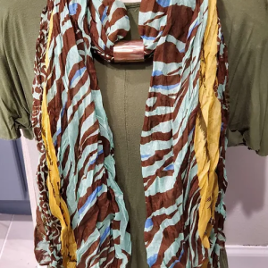 Copper Embellishment for Blue and Brown Animal Print Bordered in Yellow Scarf. Scarf included. Shown on mannequin.