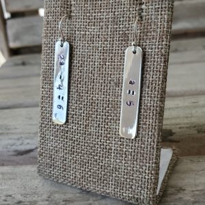 Stamped Algebra Equation Rectangle Sterling Silver Earrings showing 2a minus 4 equals 6 on one earring and a equals 5 on the other.