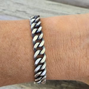 Curb Link Bracelet polished on outside and darkened inside shown on model's arm