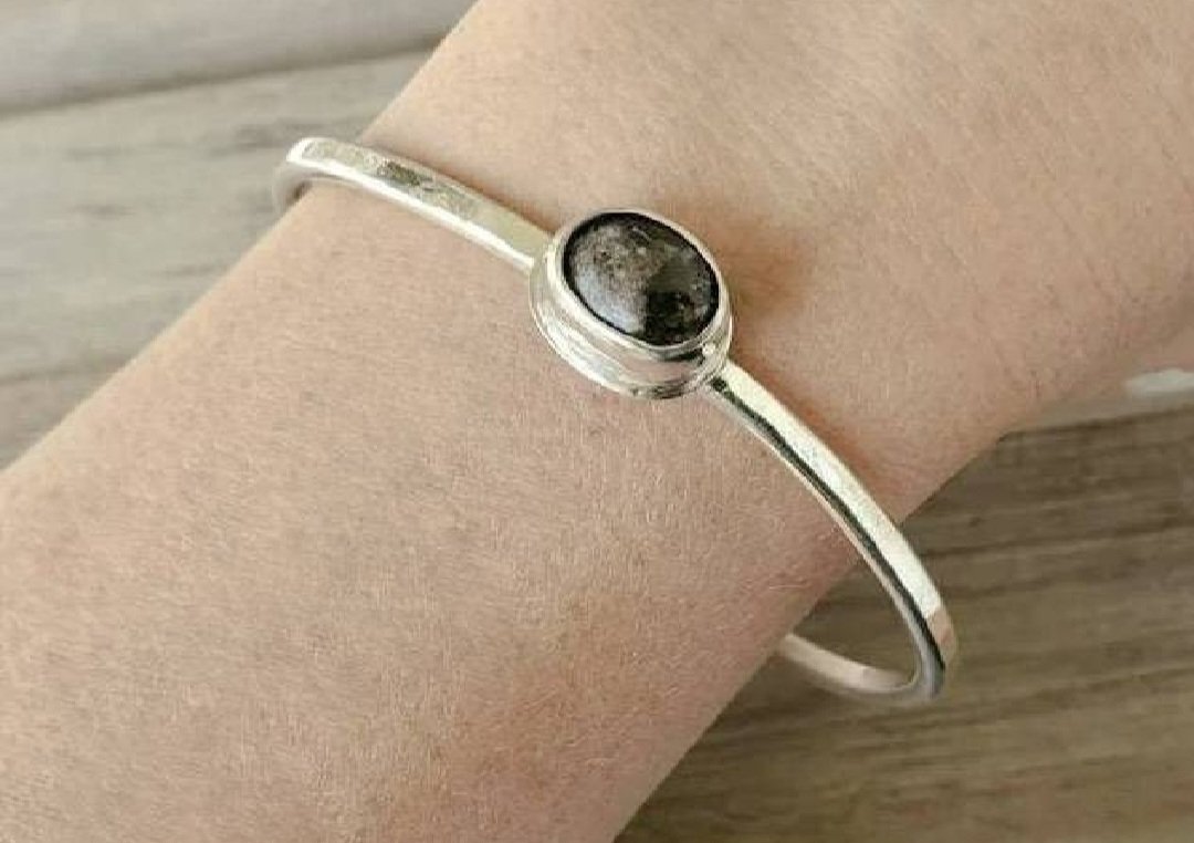 Black Agate Cabochon in Sterling Bezel Setting on a Sterling Silver Bangle Bracelet shown on model's arm