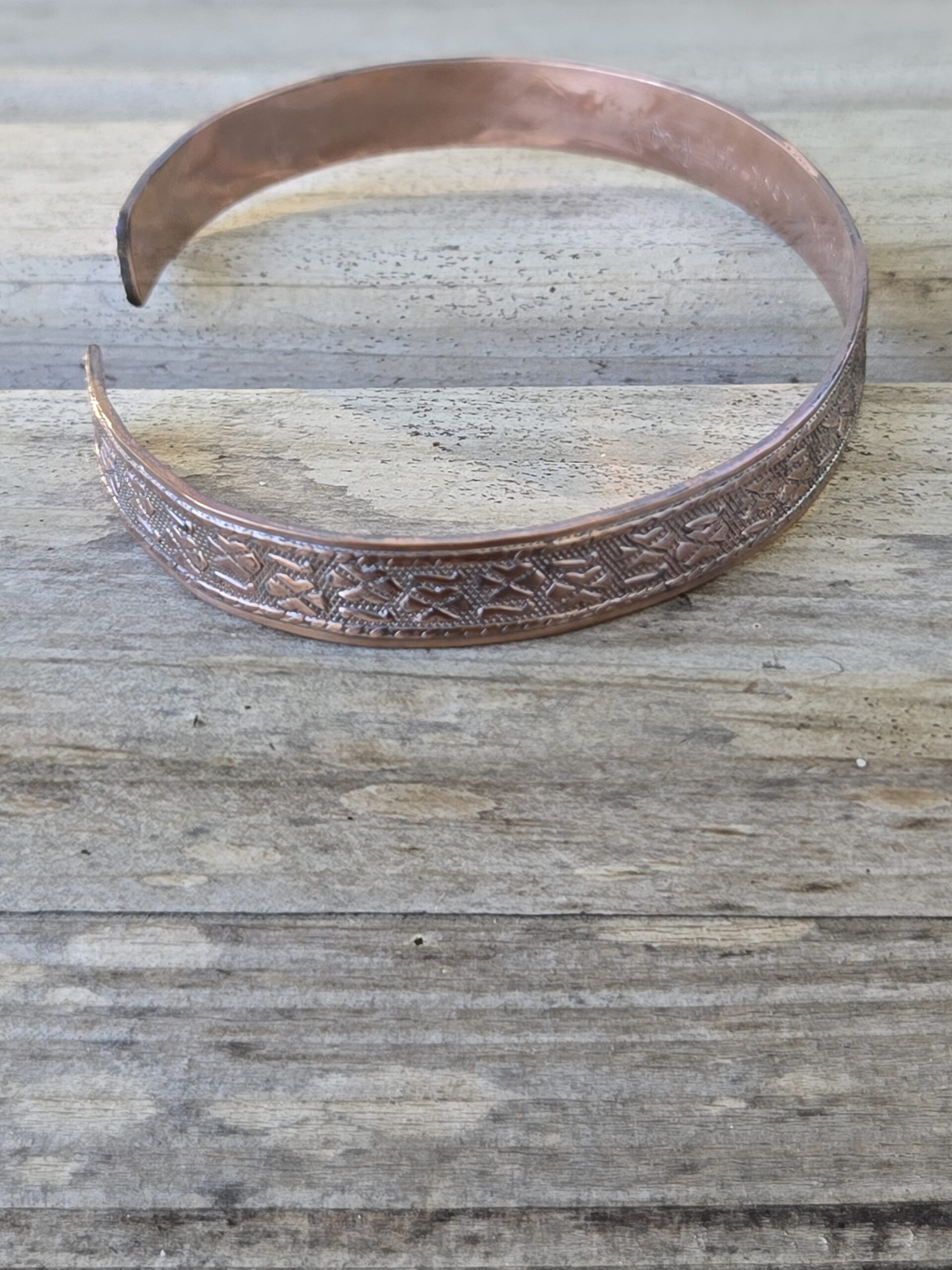Personalized and Textured Copper Bracelet shown from the side to see coloring and texture