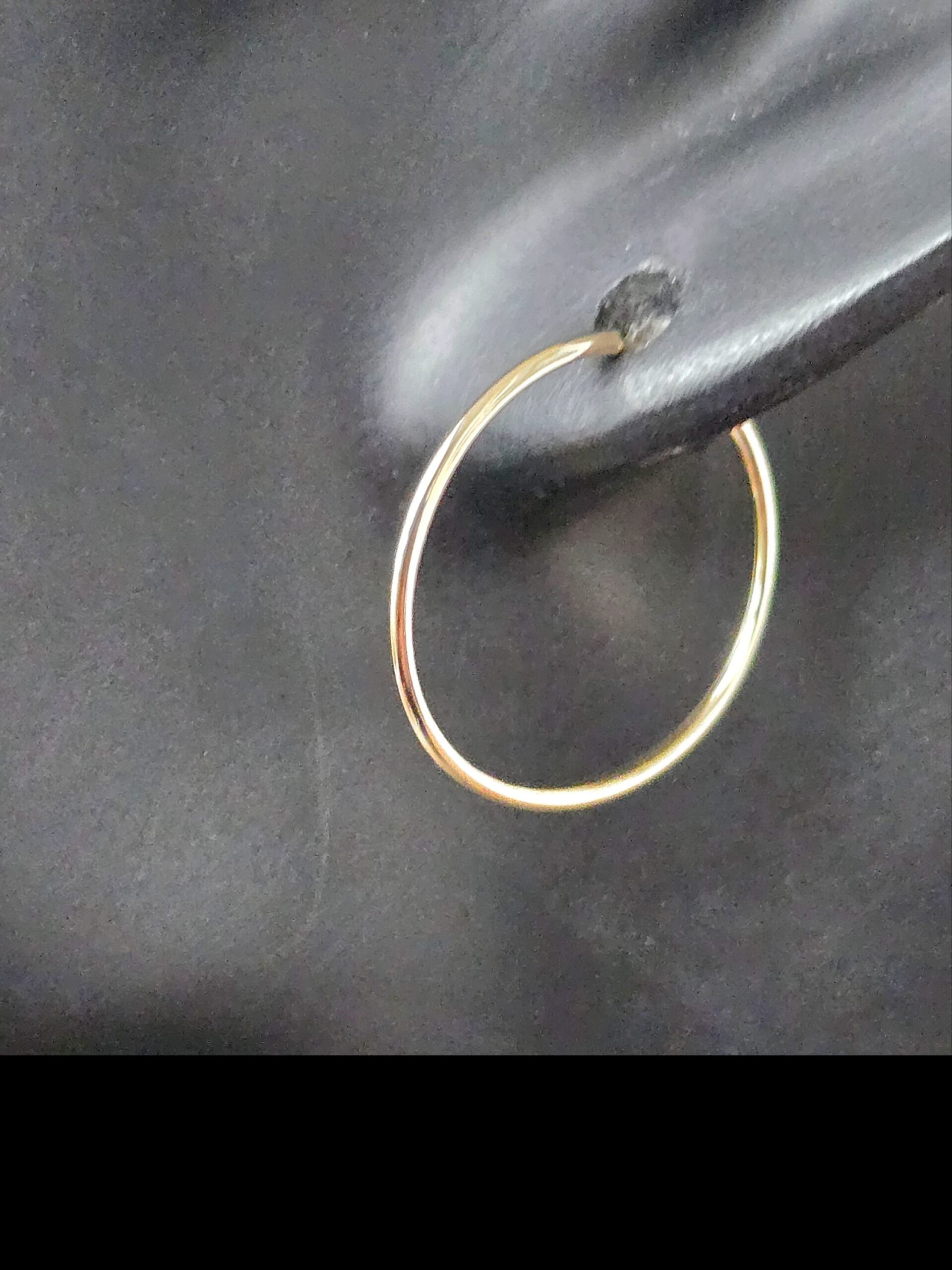 14K Yellow Gold Endless Hoop Earrings shown on a mannequin from the side