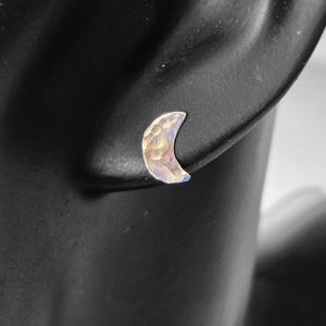 Hammered sterling silver crescent moon post earrings on mannequin.